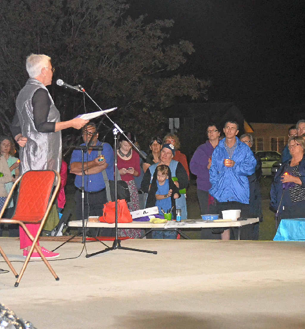 Warwick residents show their support for refugees at a candlelight vigil held in March.